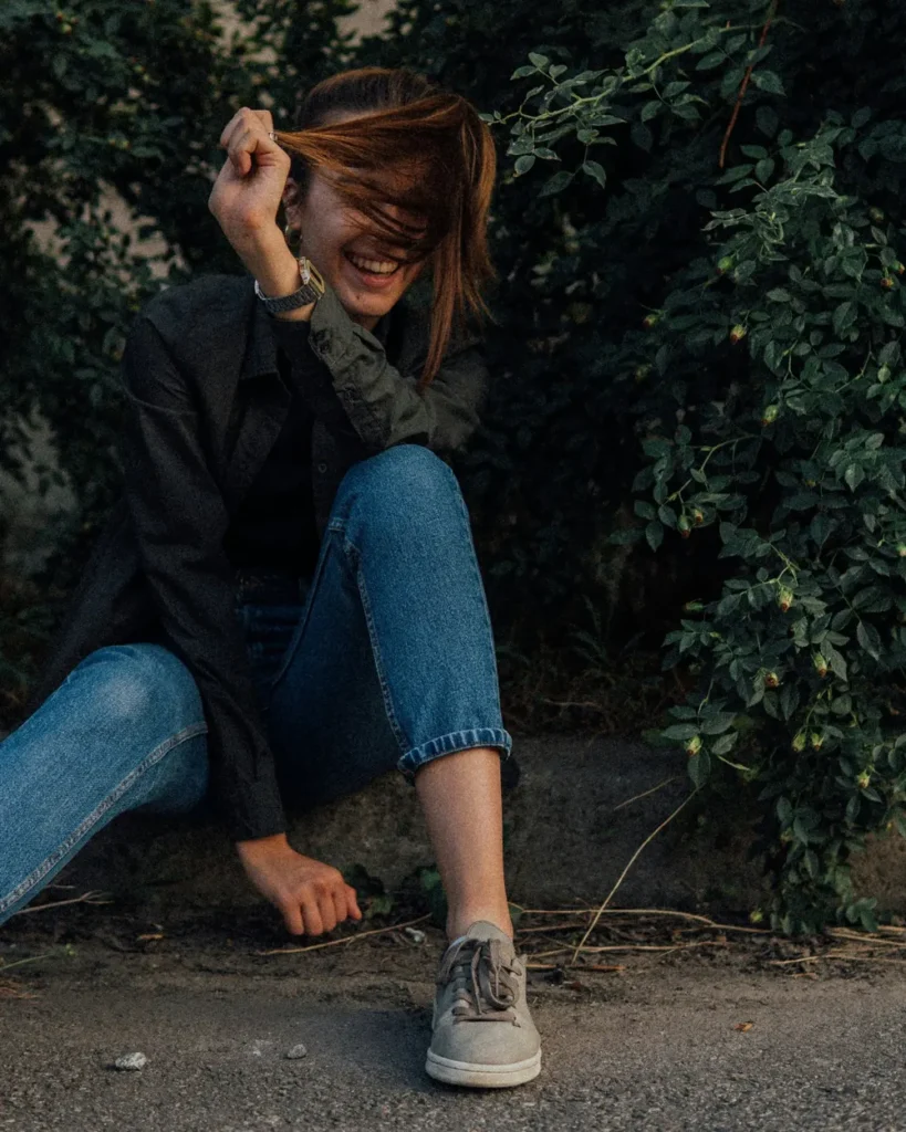 Person wearing washed denim jeans
